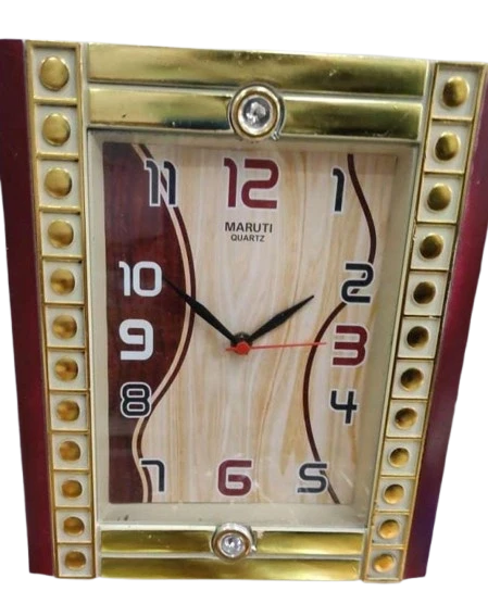 "Square Analog Clock with Red and Black Hands, Gold and Maroon Frame, and MARUTI QUARTZ"
